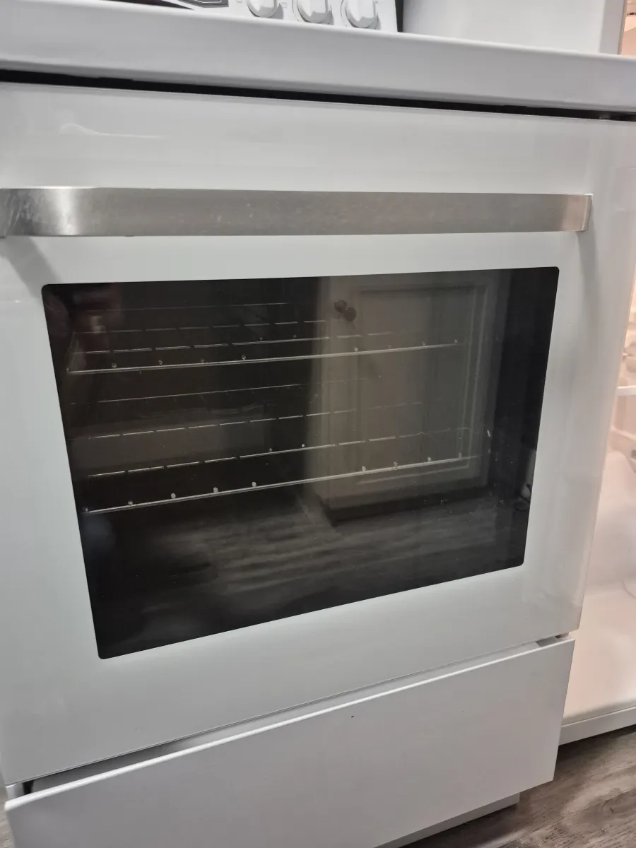White oven front glass cleaned from inside
